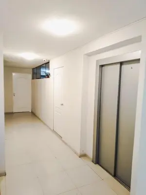 an empty room with white walls and doors at Departamento Monterrico in Lima