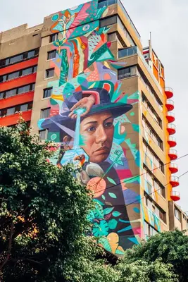 a building with a mural on the side of it at Naia Hoteles in Lima