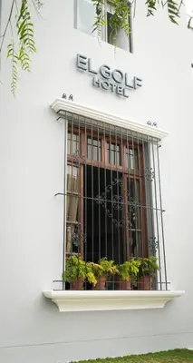 a building with a window with plants in it at El Golf Hotel Boutique in Lima