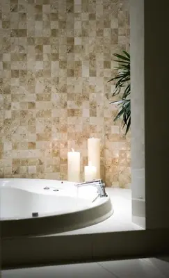 a bathroom with a bath tub with candles in it at El Golf Hotel Boutique in Lima