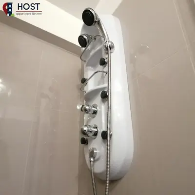 a shower in a bathroom with a shower head at Host, Apartment for rent in Lima