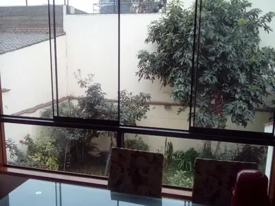 a room with a window with plants on it at Hospedaje La Anita in Lima