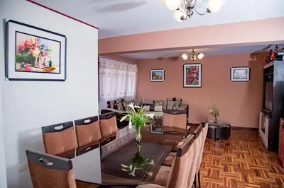 a dining room with a table and chairs at Euler House`s in Cusco