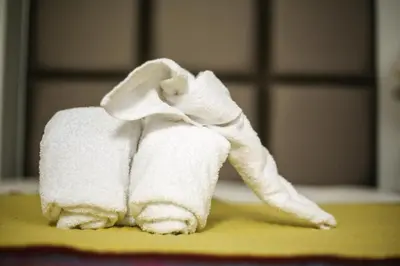a towel elephant sitting on top of a table at Hostal Mica in Abancay