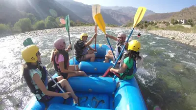 a group of people in a raft on a river at Hostal Mica in Abancay