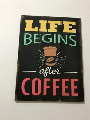 a sign that reads life begins after coffee at Edificio California en Centro Historico in Lima