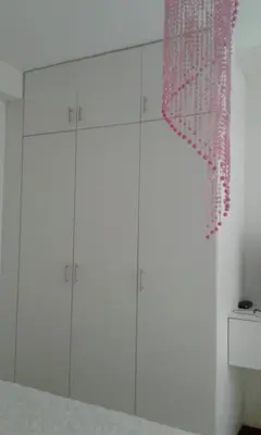 a room with white cabinets and a pink curtain at Edificio California en Centro Historico in Lima
