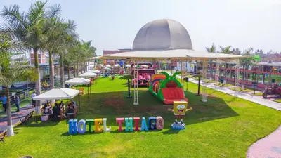an amusement park with a playground with a slide at Hotel Resort Thiago in Chincha Alta