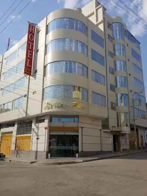 a large building with a sign for a hotel at Hotel Wanka Palace in Huancayo