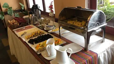 a buffet with food on a table with at Hotel de Turistas Abancay in Abancay
