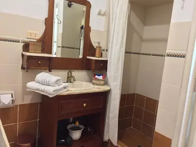 a bathroom with a sink and a mirror at Best place in Plaza Mayor Lima, Pizarro building in Lima