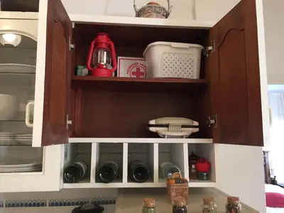 a kitchen cupboard filled with lots of kitchen items at Best place in Plaza Mayor Lima, Pizarro building in Lima