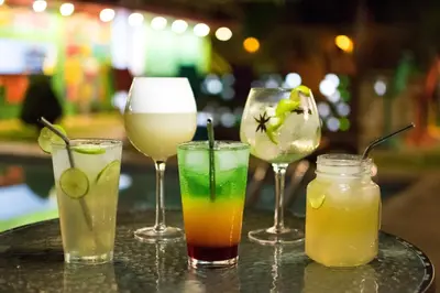 a group of four different types of drinks on a table at The Upcycled Hostel in Ica