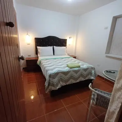 a bedroom with a bed in a room at El Capricho Paracas in Paracas