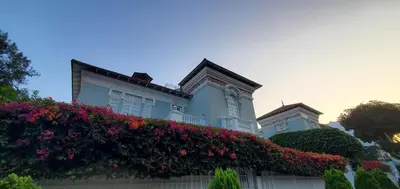 a large house with flowers in front of it at Villa Barranco by Ananay Hotels in Lima