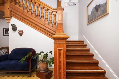 a stairway with a blue couch and a blue chair at Villa Barranco by Ananay Hotels in Lima