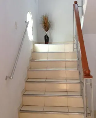 a stairway with a potted plant on top of it at Hostal La Estancia in Ica