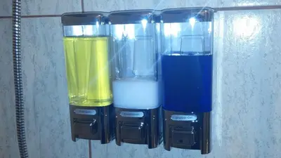 three different colored blenders sitting on a shelf at Kangaroo Wasi Airport Bed & Breakfast in Lima