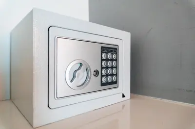a white microwave oven with a remote control at Apart Hotel Petit Palace Suites in Lima