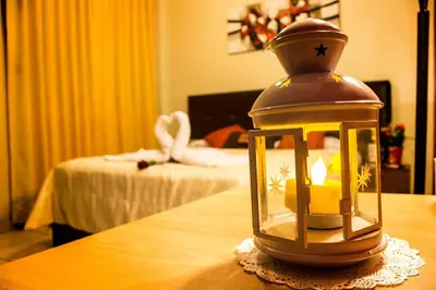 a lantern sitting on top of a wooden table at Hotel Queen in Lima
