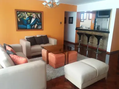 a living room with a couch and a table at Miraflores in Lima
