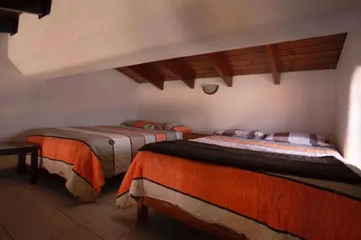 a bedroom with two beds in a room at Family House in Lima
