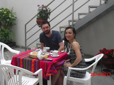 a man and a woman sitting at a table at Kelebek Hostel in Lima