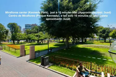 a man sitting on a bench in a park at ALU Apartments - Limit with Miraflores Panoramic City View in Lima