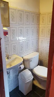 a bathroom with a toilet and a sink at Killari B&B in Ollantaytambo