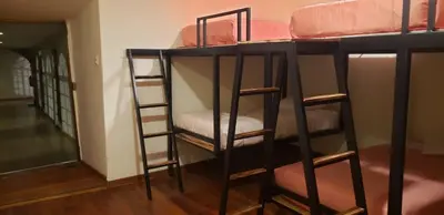 a group of bunk beds in a room at Hommam in Cusco