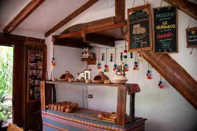 a room with a counter with a chalkboard on the wall at Casita Huaran in Calca