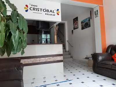 a lobby with two chairs and a reception desk at Hostal Don Cristobal in Ayacucho