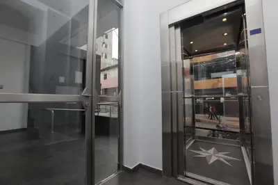 a glass door in a building with a star on it at Hotel Murano in Abancay