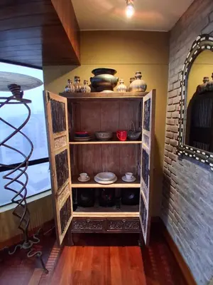 a shelf filled with pots and pans in a room at Black Shark Apartments in Lima