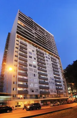 a large building with cars parked in front of it at Departamento Lima in Lima