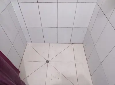 a white tiled room with a ceiling at Passion Hostel - Barranco in Lima