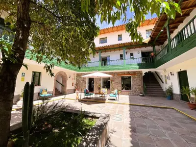 an external view of a building with a courtyard at Usgar San Pedro Boutique in Cusco