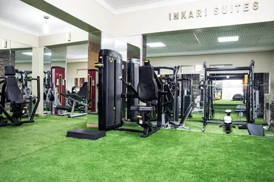a gym with lots of treadmills and machines at Inkari Suites Hotel in Lima