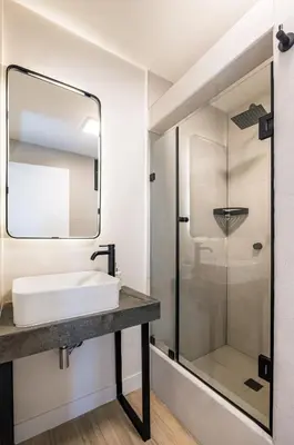 a bathroom with a sink and a shower at Miraflores Suites Centro in Lima
