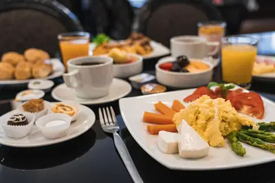 a table with plates of food on a table at Jose Antonio Executive in Lima