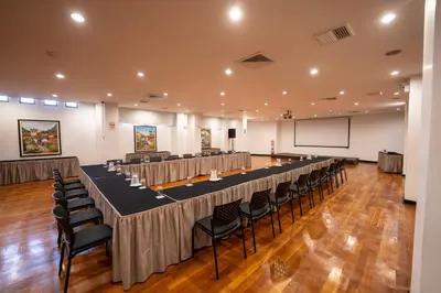 a large room with a long table and chairs at Hotel Jose Antonio Cusco in Cusco