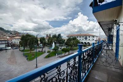 a view of a city from a balcony at Hotel Hacienda Cusco Plaza in Cusco