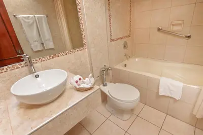 a bathroom with a sink and a toilet and a tub at Hotel Ruinas in Cusco