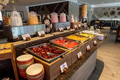 a buffet line with fruits and vegetables on display at Casa Andina Premium Miraflores in Lima