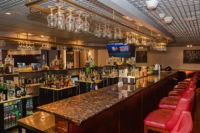 a bar with a long counter in a room at Casa Andina Premium Miraflores in Lima