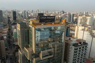a tall building with a sign on top of it at Casa Andina Premium Miraflores in Lima