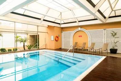 a pool in a building with a swimming pool at Casa Andina Premium Miraflores in Lima
