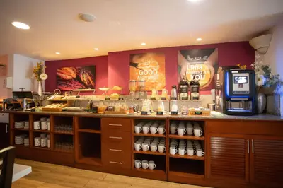 a coffee shop with a counter with a coffee machine at Centro by Casa Andina Miraflores in Lima