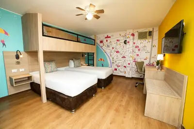 a bedroom with two beds and a ceiling fan at Centro by Casa Andina Miraflores in Lima