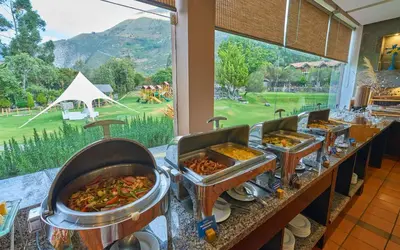 a buffet line with many different types of food at Casa Andina Premium Valle Sagrado Hotel & Villas in Urubamba